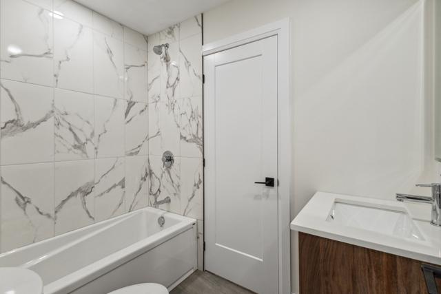 Bathroom with marble-look tile