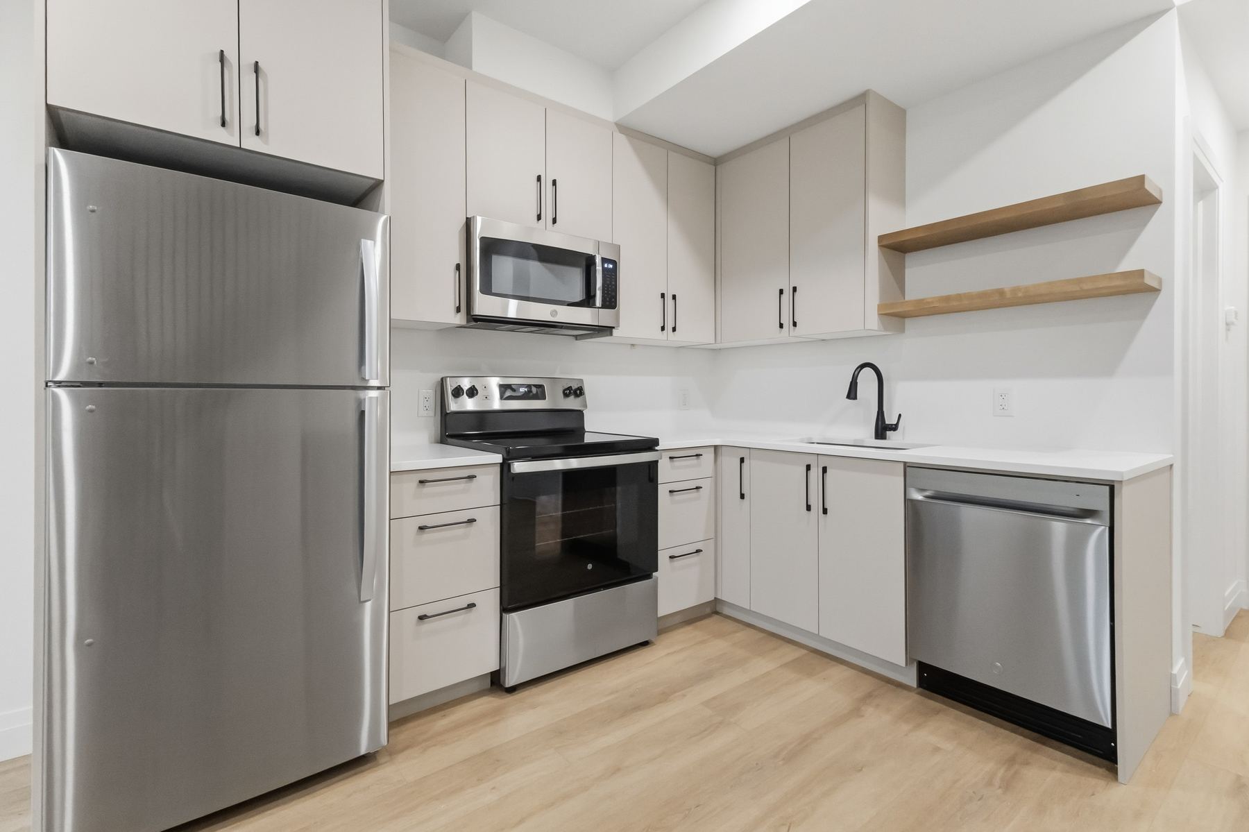 Kitchen with stone countertops and new stainless steel appliances