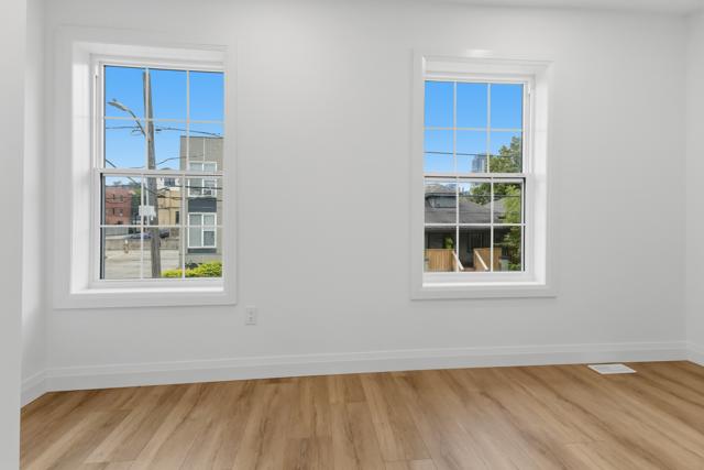 Bright bedroom with two large windows